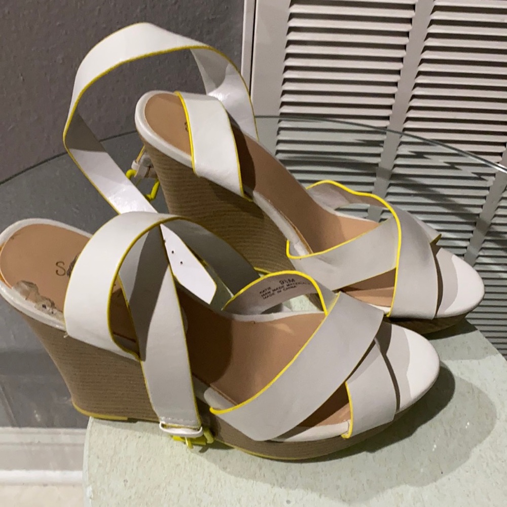 Super cute white wedge trimmed in neon yellow!